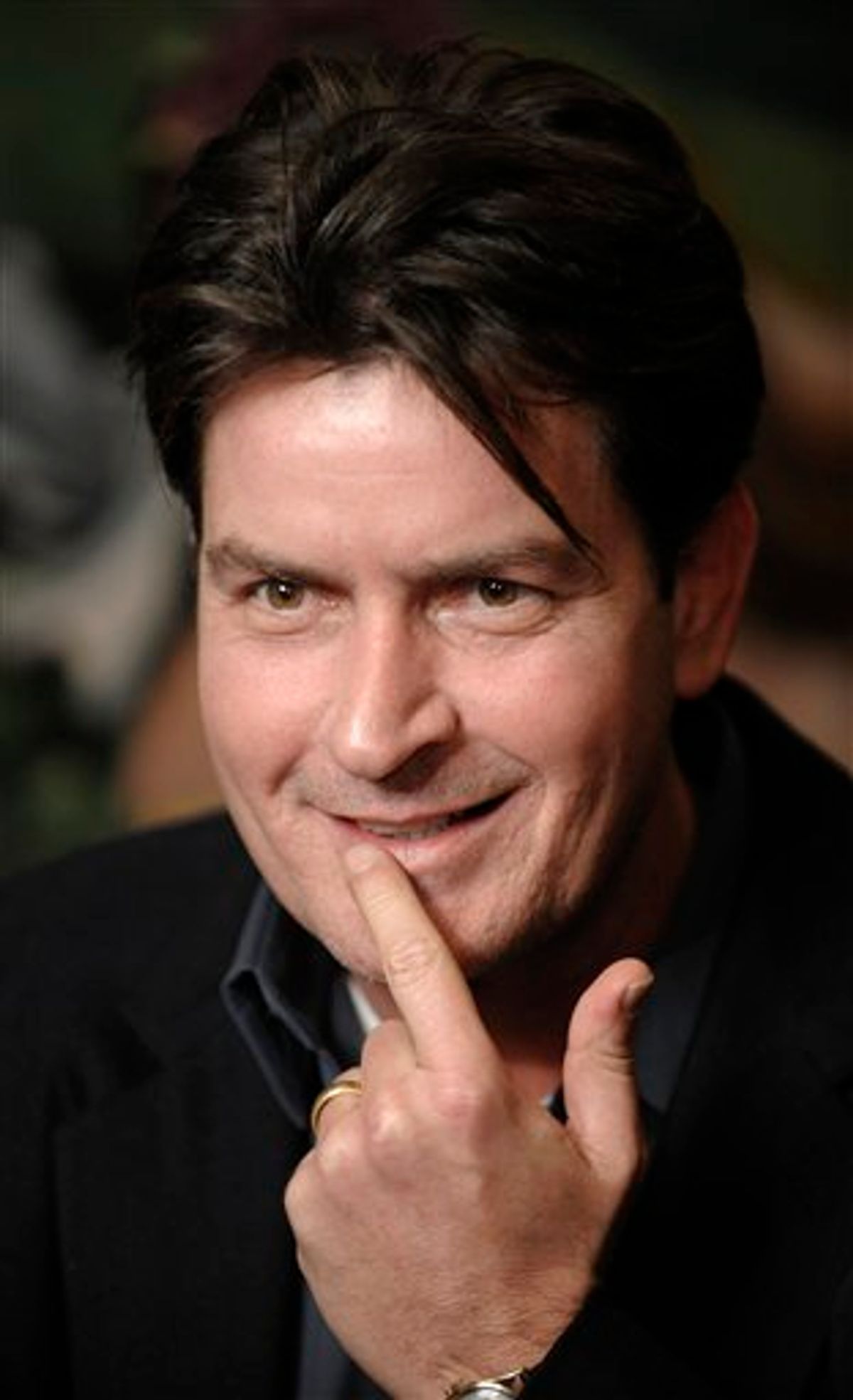 FILE - In this Jan. 28, 2009 file photo, actor Charlie Sheen is interviewed at an event to celebrate Planet Hollywood's purchase of Italian restaurant chain Buca di Beppo, at Universal CityWalk in Los Angeles. Sheen says Wednesday, March 2, 2011 that after his two young sons were removed from his house overnight, he's "very calm and focused" but ready to fight to get them back. Interviewed Wednesday live on NBC's "Today" show, Sheen confirmed the nearly 2-year-old twins, Bob and Max, were removed after a court order was granted to his estranged wife, Brooke Mueller, who is their mother. (AP Photo/Chris Pizzello, File)   (AP)