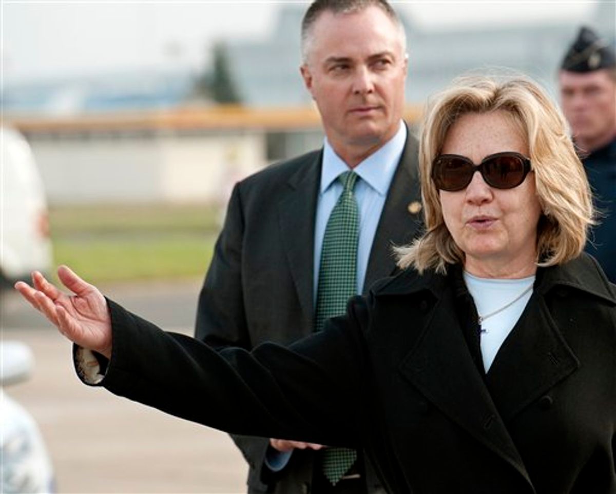 US Secretary of State Hillary Clinton gestures after arriving Monday, March 14, 2011, at Le Bourget airport, north of Paris. U.S. Secretary of State Hillary Rodham Clinton is in Paris for talks with European and other leaders on the crisis in Libya. Her talks will include a meeting with Libyan opposition figures as the Obama administration makes its first high-level contact with foes of Moammar Gadhafi. (AP Photo/Paul J Richards, Pool) (AP)