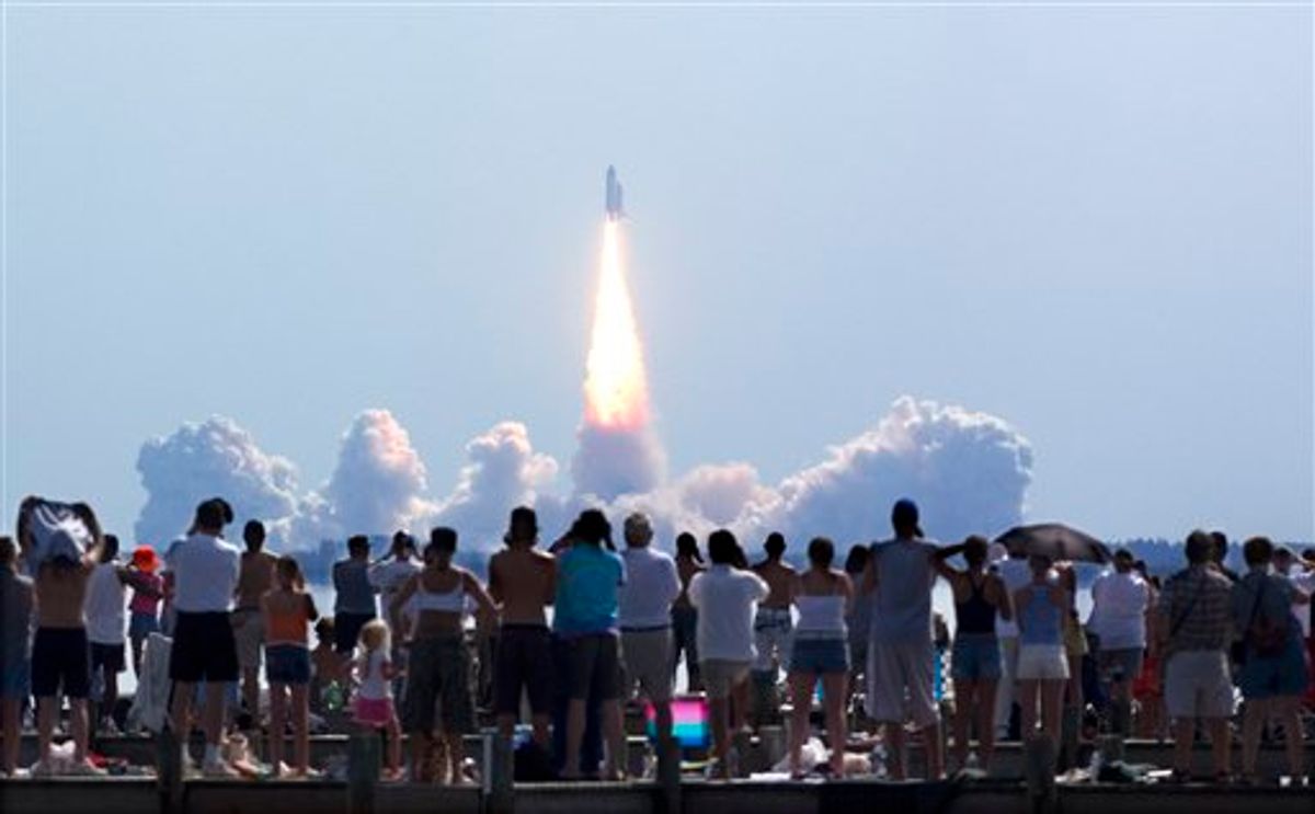 FILE - In this Tuesday, July 26, 2005 file picture, crowds watch as Space Shuttle Discovery lifts off from Kennedy Space Center in Cape Canaveral, Fla. Discovery and seven astronauts blasted into orbit Tuesday on America's first manned space shot since the 2003 Columbia disaster, ending a painful, 2-year shutdown devoted to making the shuttle less risky and NASA more safety-conscious.  (AP Photo/Phil Sandlin)   (AP)