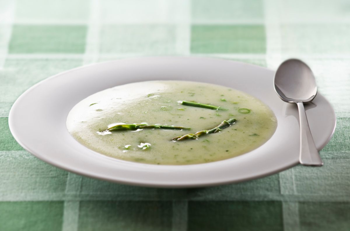 Fresh asparagus soup in white plate close up (Dusan Zidar)