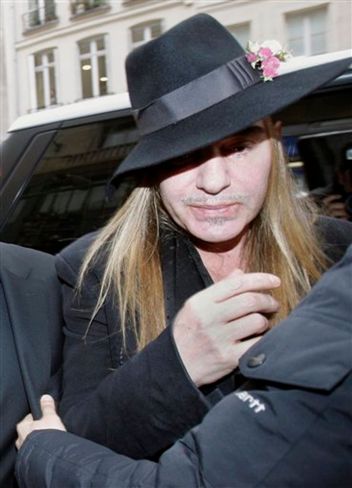 FILE - In this Monday, Feb. 28, 2011 file photo, Fashion designer John Galliano arrives at a police station in Paris. Christian Dior have fired Galliano  in wake of alleged anti-Semitic remarks he made during a dispute at a trendy Paris cafe. (AP Photo/Michel Euler, File)   (AP)