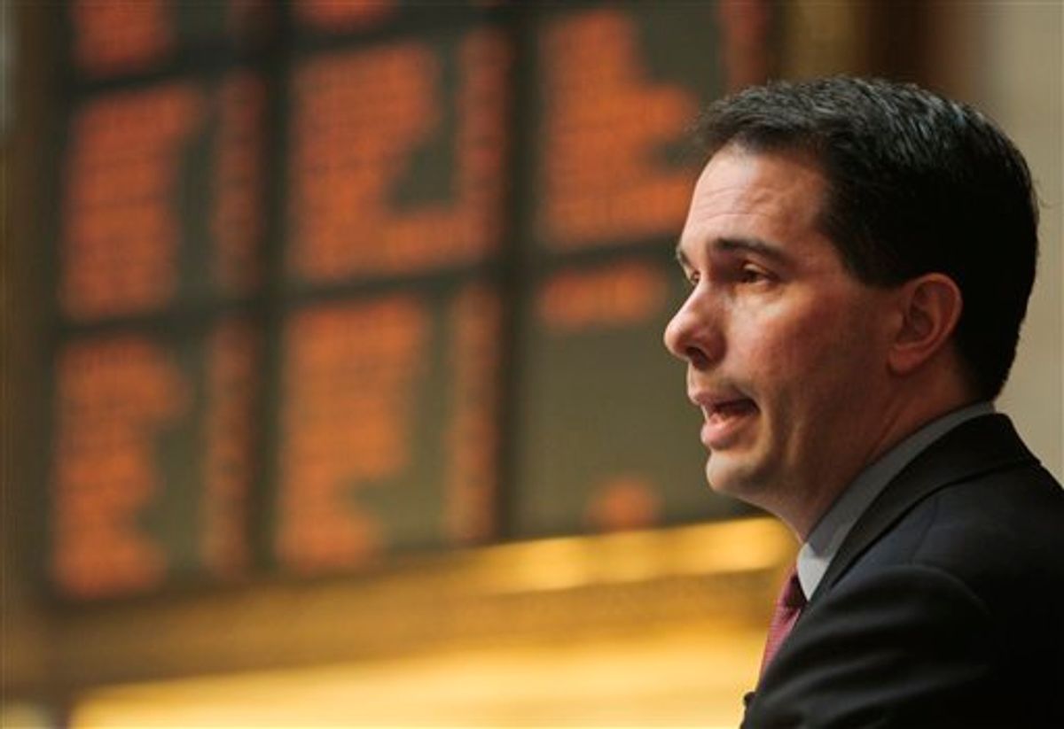 Wisconsin Gov. Scott Walker addresses a joint session of the Legislature at the state Capitol in Madison, Wis., Tuesday, March 1, 2011. Opponents to the governor's bill to eliminate collective bargaining rights for many state workers have been protesting the governor's budget for 14 days at the Capitol. (AP Photo/Andy Manis) (AP)