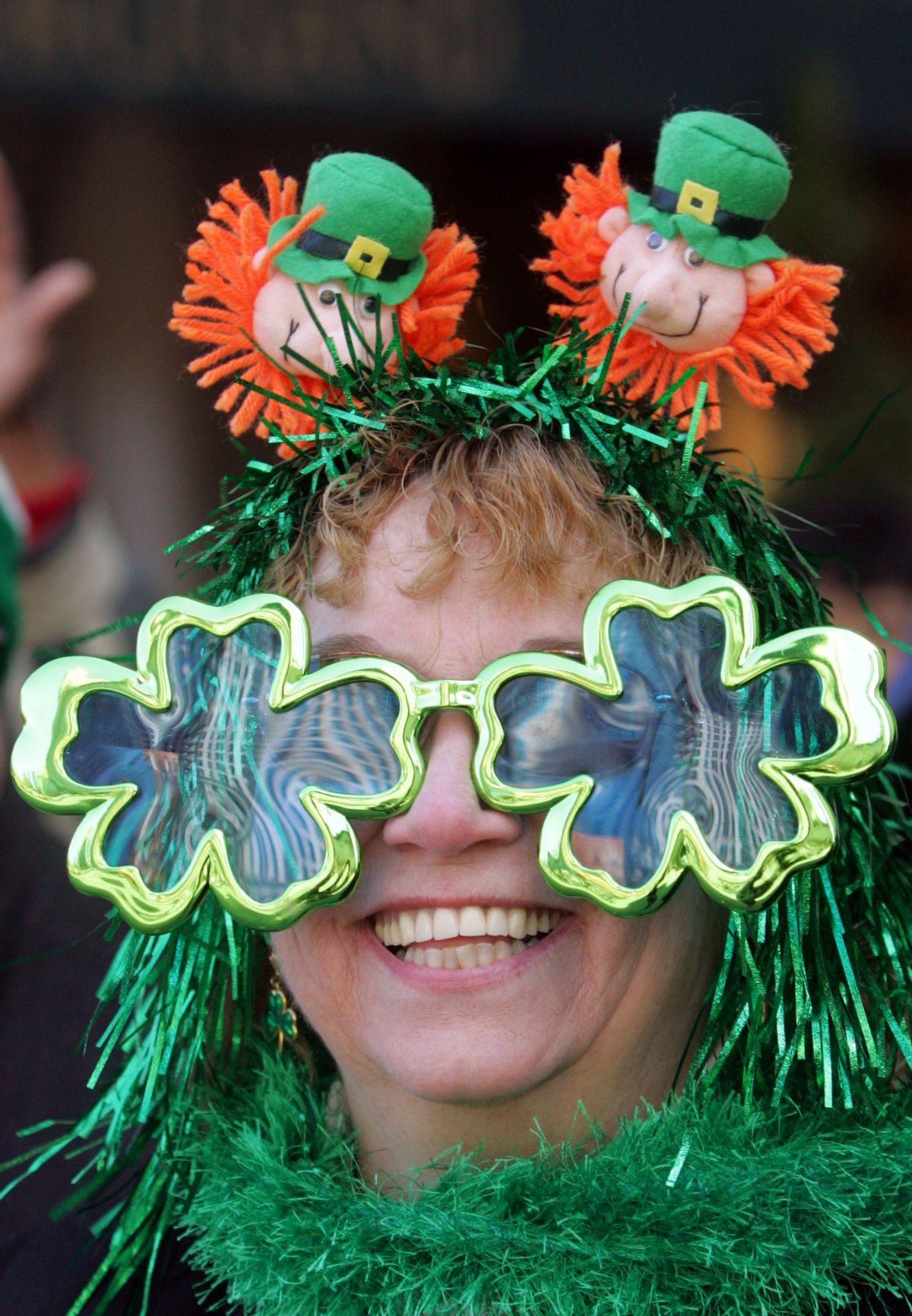 Geralyn Monahan-Jones, from Beacon, NY, greets participants of the annual St. Patrick's Day Parade on Fifth Avenue, Friday, March 17, 2006 in New York. This is the 245th year that St. Patrick's Day Parade has been held in New York City. (AP Photo/Dima Gavrysh) (AP)