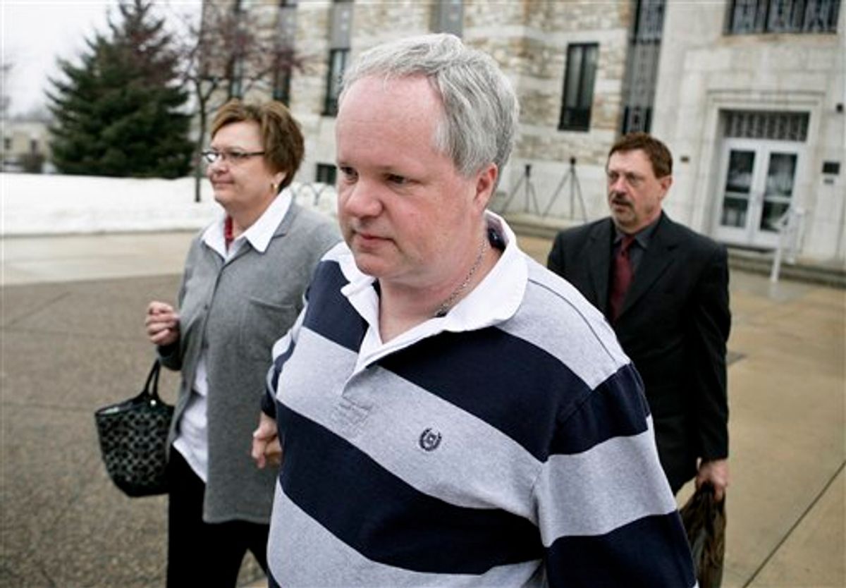 FILE - In this Feb. 17, 2011 file photo, William Melchert-Dinkel, center, leaves the Rice County Courthouse in Faribault, Minn., with his attorney Terry Watkins, right, and wife, Joyce Melchert-Dinkel, after waiving his right to a jury trial. Melchert-Dinkel, 48, of Faribault, was found guilty Tuesday, March 15, 2011 of aiding the suicides of 18-year-old Kajouji of Brampton, Ontario, who jumped into a river in 2008, and 32-year-old Mark Drybrough of Coventry, England, who hung himself in 2005. (AP Photo/Robb Long, File) (AP)