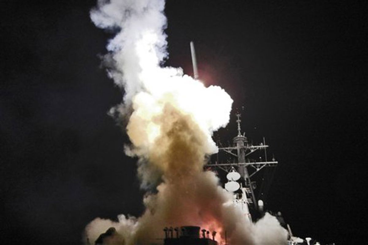 This Saturday, March 19, 2011 photo provided by the U.S. Navy shows the Arleigh Burke-class guided-missile destroyer USS Barry (DDG 52) as it launches a Tomahawk missile in support of Operation Odyssey Dawn from the Mediterranean Sea . The U.S. fired more than 100 cruise missiles from the sea while French fighter jets targeted Moammar Gadhafi's forces from the air on Saturday, launching the broadest international military effort since the Iraq war in support of an uprising that had seemed on the verge of defeat. (AP Photo/U.S. Navy, Fireman Roderick Eubanks) (Fireman Roderick Eubanks)