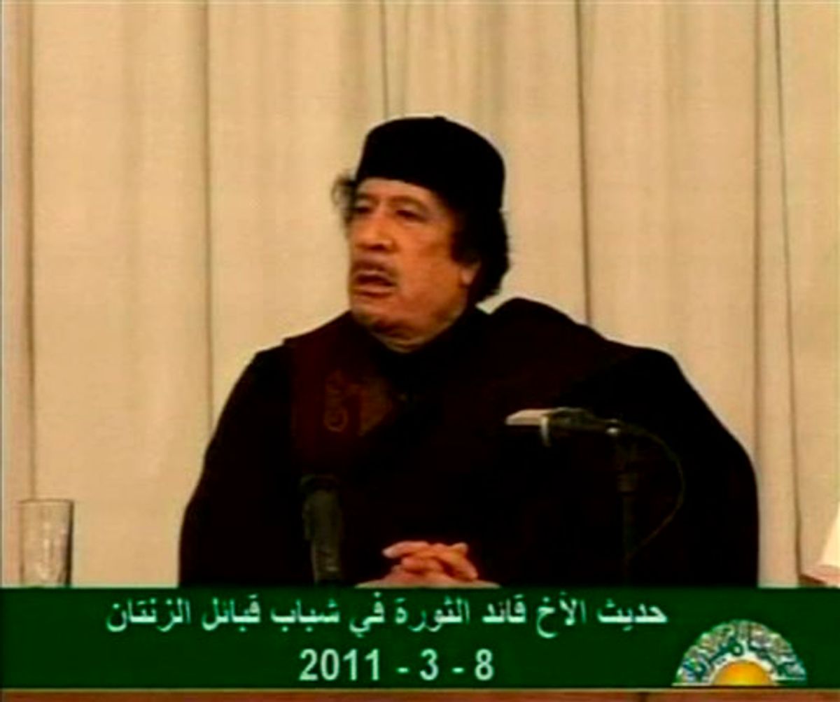 This video image taken from Libyan state television broadcast on Wednesday March 9, 2011 shows Libyan leader Moammar Gadhafi addressing supporters in Tripoli, Libya. (AP Photo/Libyan state television via APTN)   LIBYA OUT, TV OUT (AP)