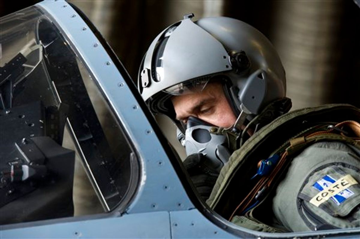 This photo provided by the French Army shows pilot preparing to take off in a French Mirage 2000 jet fighter at the military base of Dijon, central France, Saturday, March 19, 2011. Top officials from the United States, Europe and the Arab world have launched immediate military action to protect civilians as Libyan leader Moammar Gadhafi's forces attacked the heart of the country's rebel uprising. The Mirages 2000 are operating in Libya. (AP Photo/ Anthony Jeuland; SIRPA AIR) NO SALES (AP)