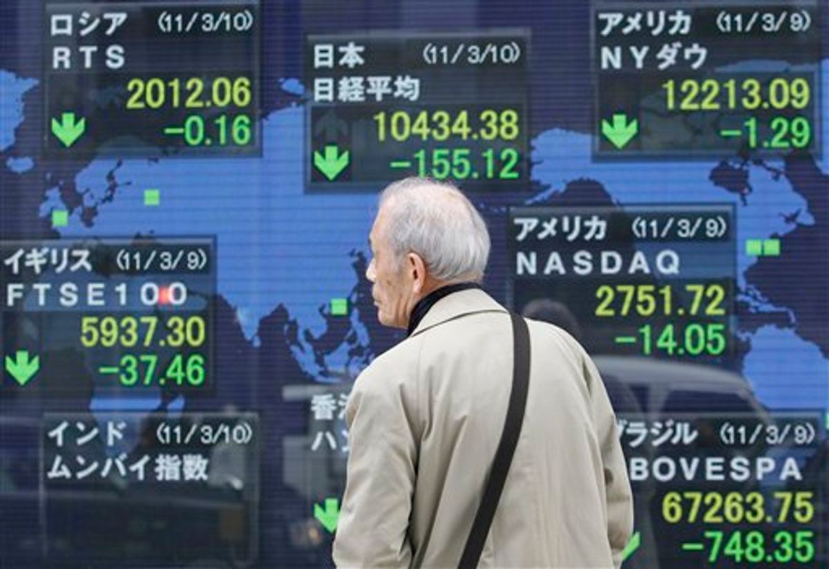 A man looks at a securities firm's stock board in Tokyo as Japan's Nikkei 225 stock average lost 155.12 points to close at 10,434.38 Thursday, March 10, 2011. Asian shares fell Thursday, weighed down by ongoing fighting in Libya and a larger than expected contraction in Japan's economy. (AP Photo/Koji Sasahara) (AP)