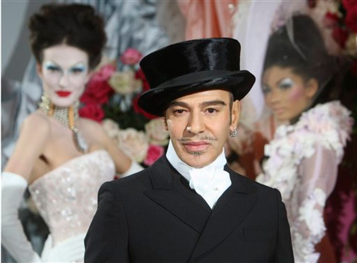 FILE - In this Jan. 25, 2010 file photo, fashion designer John Galliano poses at the end of the presentation of the Dior Haute Couture spring/summer 2010 fashion collection in Paris. Christian Dior said Tuesday, March 1, 2011, that Galliano has been immediately laid off, just days after he was suspended as its creative director pending an investigation into an alleged anti-Semitic incident in a Paris cafe last week.(AP Photo/Jacques Brinon)   (AP)