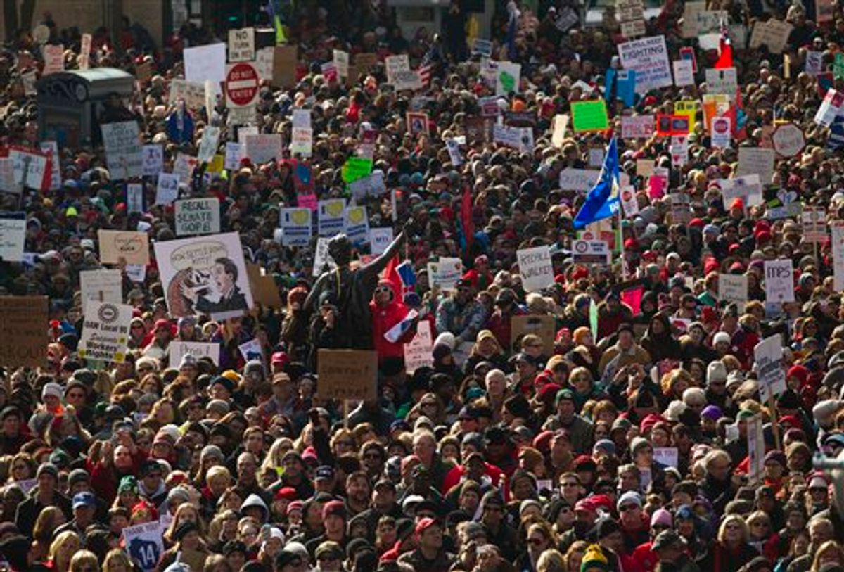 Thousands of pro-labor protesters rallied at the Wisconsin Capitol Saturday, March 12, 2011, in Madison, Wis., vowing to fight back after the state's Republican governor signed into law a controversial bill that eliminates most union rights for public employees.(AP Photo/Morry Gash) (AP)