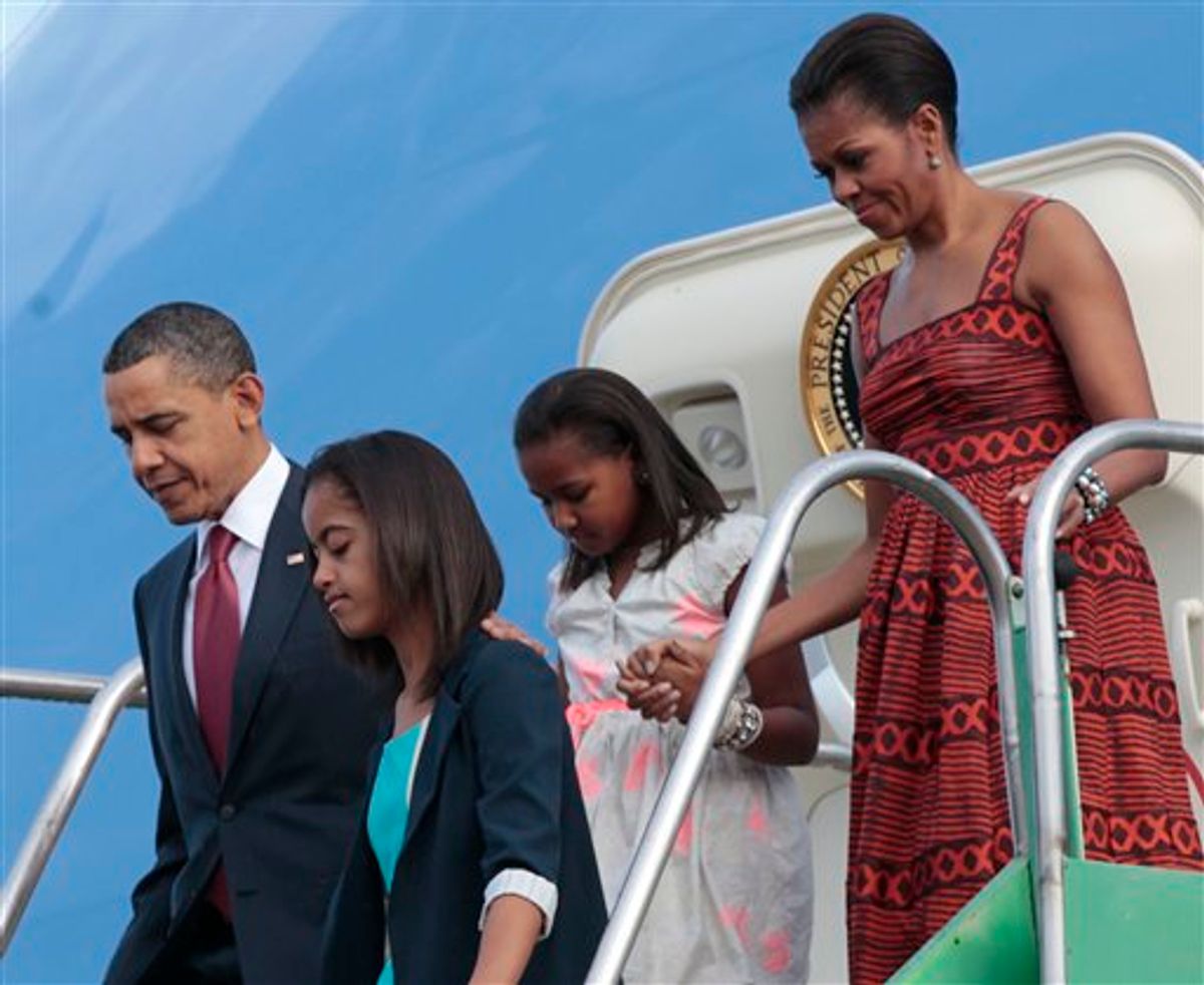 US President Barack Obama, far left, with first lady Michelle Obama, far right, and daughters Malia, and Sasha, center, during their airport arrival at Brasilia Air Base in Brasilia, Brazil, Saturday, March 19, 2011. (AP Photo/Pablo Martinez Monsivais) (AP)
