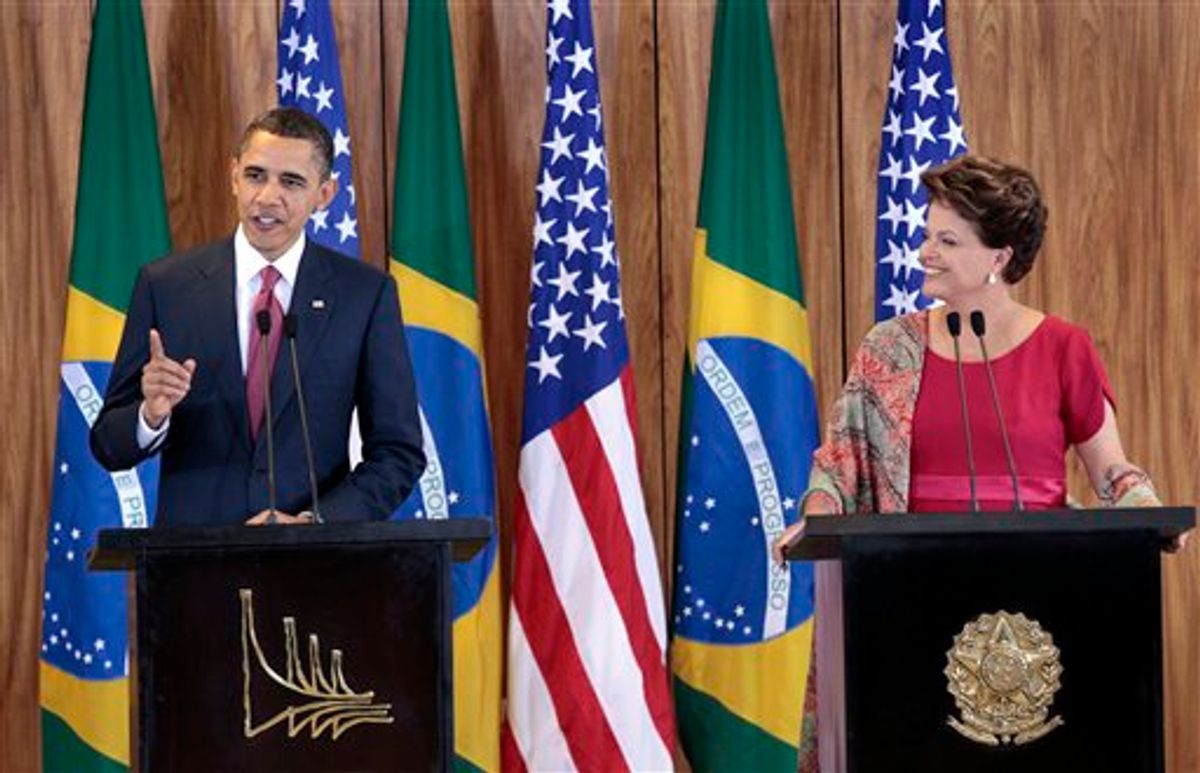 U.S. President Barack Obama, left, with Brazilian President Dilma Vana Rousseff, right, during their joint news conference at the Palacio do Planalto in Brasilia, Brazil, Saturday, March 19, 2011. Obama welcomed Brazil's rise as an economic power and said the United States would be an eager customer for its oil exports as he opened a Latin America tour against the backdrop of an escalating Western military showdown with Libya's Moammar Gadhafi.  (AP Photo/Pablo Martinez Monsivais) (AP)