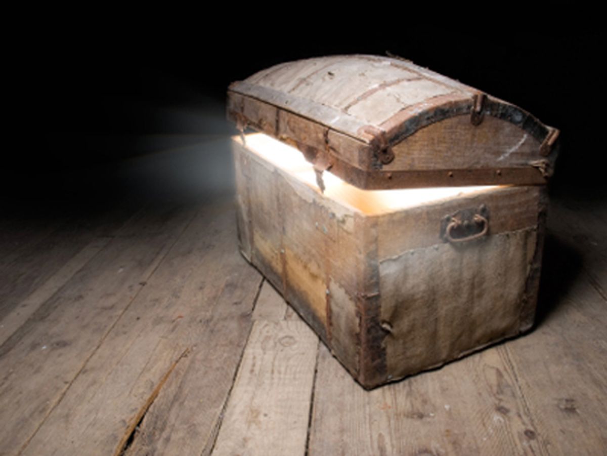 Old wooden treasure chest with strong glow from inside.