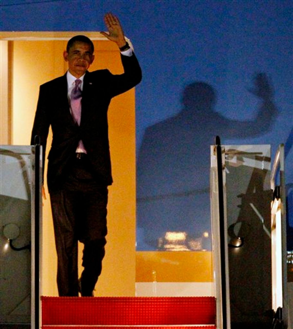President Barack Obama waves after arriving at Andrews Air Force Base, Md., Friday, March 4, 2011.   (AP Photo/Ann Heisenfelt) (AP)