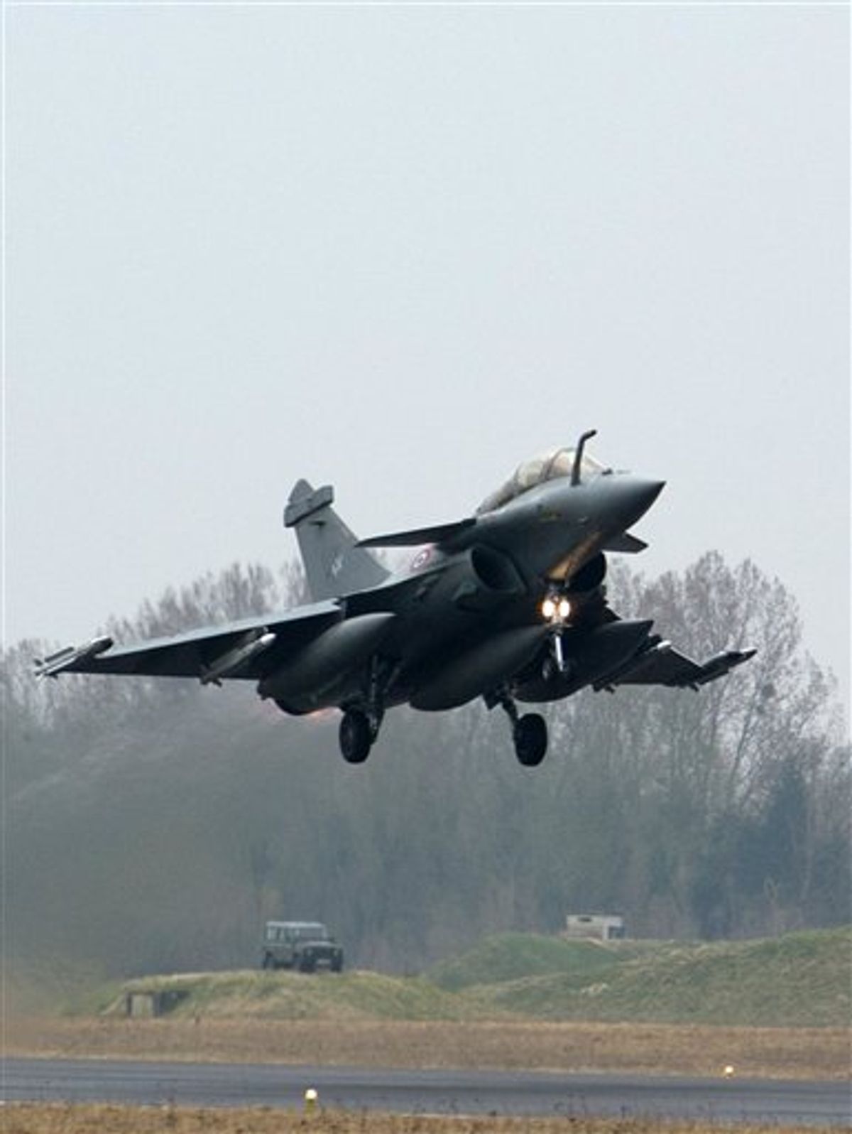 A rafale jet fighter takes off at the military base of Saint Dizier, eastern France, Saturday, March 19, 2011. Top officials from the United States, Europe and the Arab world have launched immediate military action to protect civilians as Libyan leader Moammar Gadhafi's forces attacked the heart of the country's rebel uprising. (AP Photo/ ECPAD, Sebastien Dupont) NO SALES (AP)
