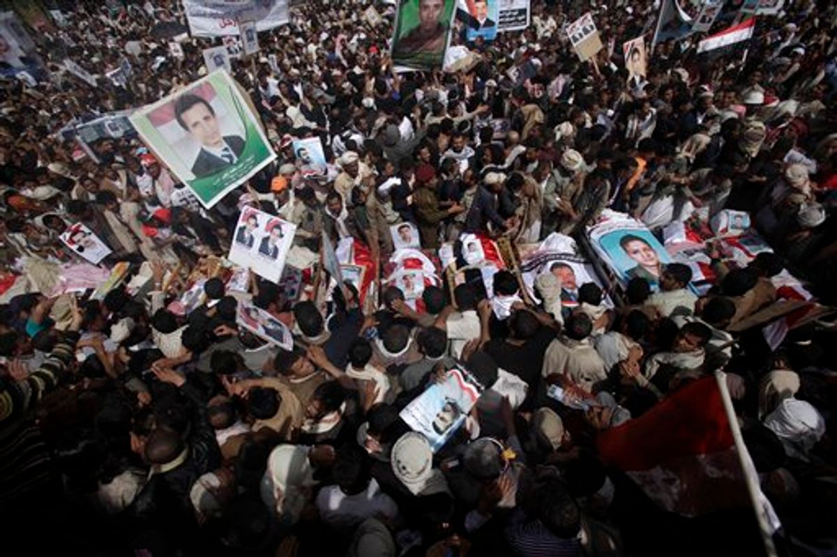 Anti-government protestors gather by the bodies of the demonstrators who were killed on Friday's clashes with Yemeni security forces, during their funeral procession in Sanaa,Yemen, Sunday, March 20, 2011. The Yemeni president's own tribe has called on him to step down after a deadly crackdown on protesters, robbing the embattled U.S.-backed leader of vital support in a society dominated by blood ties. (AP Photo/Muhammed Muheisen) (AP)
