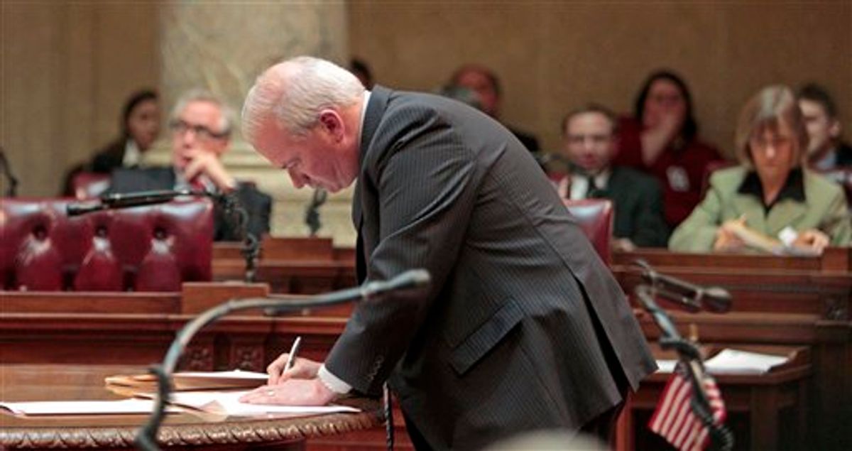 Wisconsin Senate Majority Leader Scott Fitzgeral, R-Juneau, signs orders finding the 14 missing Democrats in contempt, at the state Capitol in Madison, Wis., Thursday, March 3, 2011, . (AP Photo/Andy Manis) (AP)