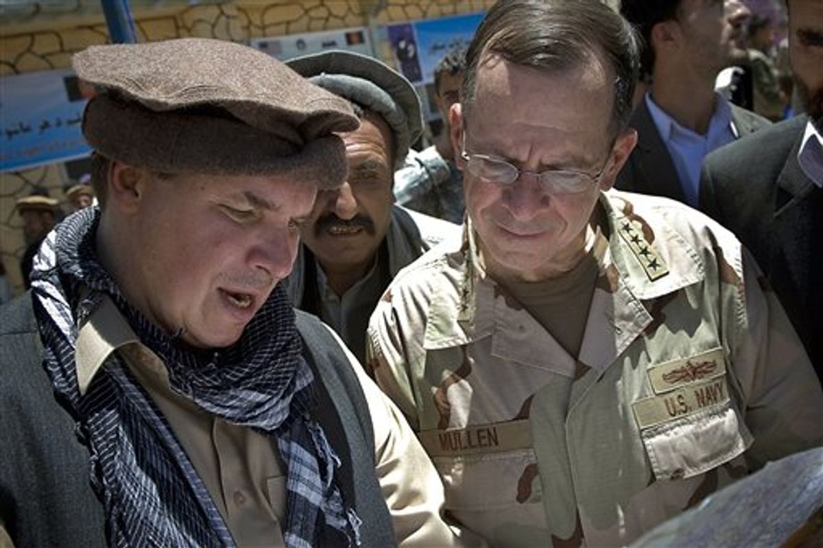 FILE - In this July 15, 2009 file photo released by Department of Defense, Three Cups of Tea co-author Greg Mortenson shows the locations of future village schools to U.S. Navy Adm. Mike Mullen, chairman of the Joint Chiefs of Staff, at the opening of Pushghar Village Girls School 60 miles north of Kabul in Panjshir Valley, Afghanistan. Montanas attorney general on Tuesday, April 19, 2011 told The Associated Press that he has launched an inquiry into the charity run by Mortenson, following investigations by 60 Minutes and author Jon Krakauer into inaccuracies in the book. (AP Photo/Department of Defense, U.S. Navy Petty Officer 1st Class Chad J. McNeeley) (AP)