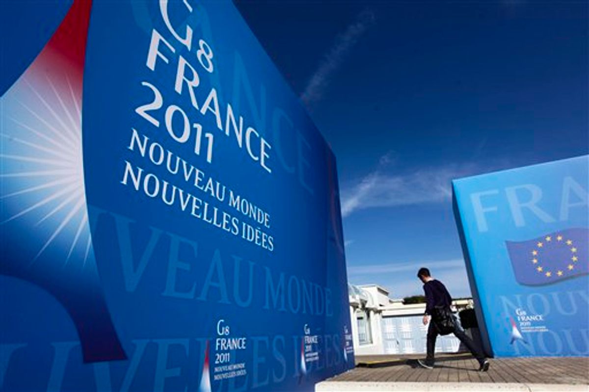 A man walks in front of the Deauville Congress Center, in Deauville, western France  on Monday, May 23, 2011 where world leaders of the G8 will meet for a summit May 26 and May 27. World leaders of the Group of Eight industrialized nations will put aside the squabbling over deficits and austerity that has marked their recent gatherings and seek to marshall their combined economic might behind the grass-roots democracy movements that have swept North Africa and the Middle East since their last meeting a year ago. (AP Photo/Markus Schreiber) (AP)