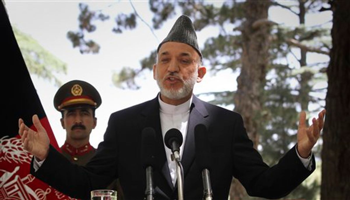 Afghan President Hamid Karzai gestures during a press conference at the presidential palace in Kabul, Afghanistan on Tuesday, May 31, 2011. Angered by civilian casualties, Karzai said Tuesday he will no longer allow NATO airstrikes on houses, issuing his strongest statement yet against strikes that the military alliance says are key to its war on Taliban insurgents. (AP Photo/Musadeq Sadeq) (AP)