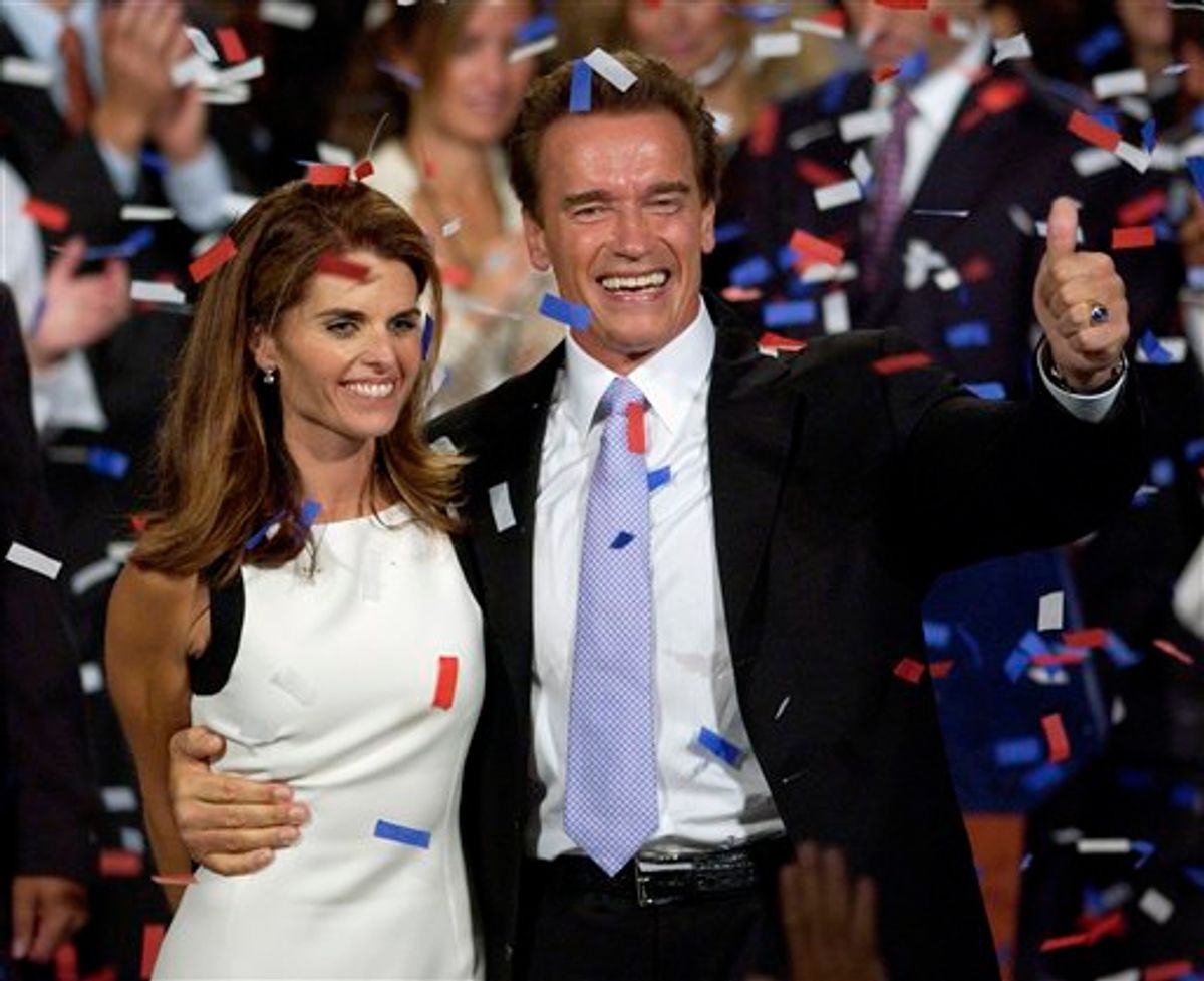 FILE - This file photo taken Oct. 7, 2003, shows Arnold Schwarzenegger and his wife, Maria Shriver ,as they  celebrate his victory in the California gubernatorial recall election in Los Angeles. The two  announced Monday, May 9, 2011, they were separating.   (AP Photo/Mark J. Terrill, File) (AP)