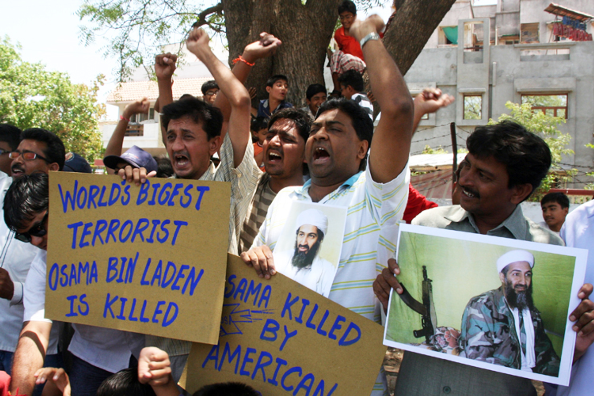 People in the western Indian city of Ahmedabad celebrate Osama bin Laden's killing May 2, 2011.