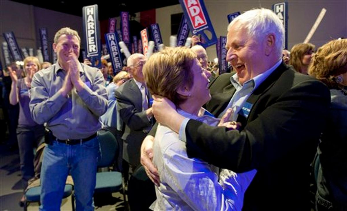 Conservative supporters celebrate as they watch election results come in, in Calgary, Alberta, Canada on Monday, May 2, 2011.  (AP Photo/The Canadian Press, Adrian Wyld) (AP)