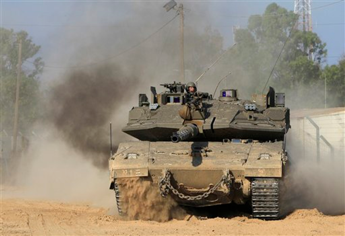 An Israeli tank advances near an army base on the Israel Gaza border in southern Israel, Sunday, May 8, 2011.