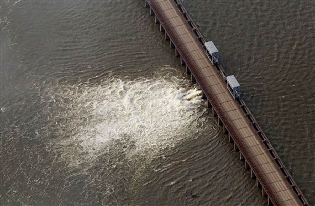 Water diverted from the Mississippi River spills through a bay in the Morganza Spillway in Morganza, La., Saturday, May 14, 2011. Water from the inflated Mississippi River gushed through a floodgate Saturday for the first time in nearly four decades and headed toward thousands of homes and farmland in the Cajun countryside, threatening to slowly submerge the land under water up to 25 feet deep. (AP Photo/Patrick Semansky)  (AP)