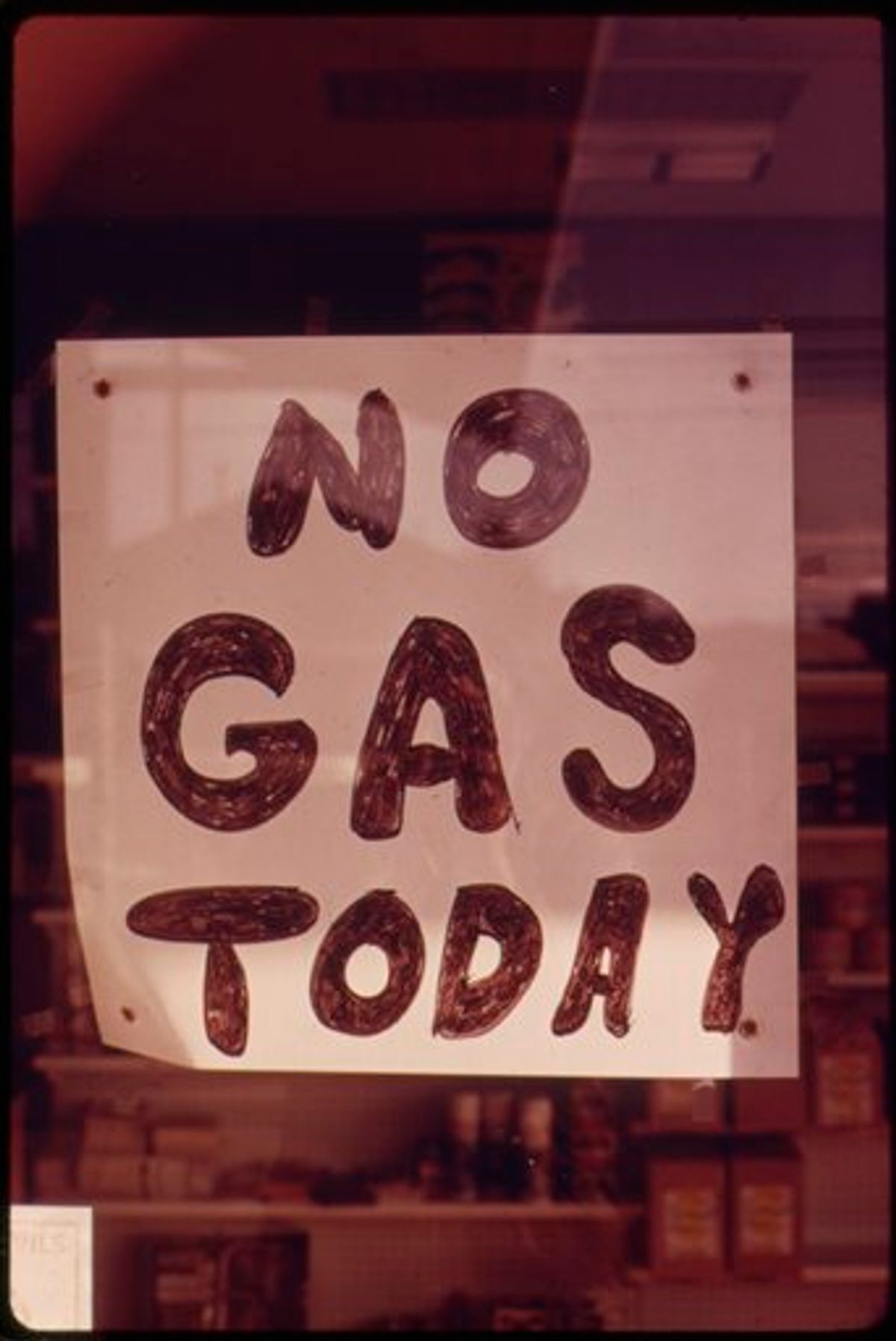 In this Oct. 1973 photo provided by the U.S. National Archives, a sign hangs in the window of a gas station in Lincoln City, Ore. The photo is part of Documerica, an EPA project during the 1970s in which the agency hired dozens of freelance photographers to capture thousands of images related to the environment and everyday life in America. Modeled after Documerica, the agency has embarked on a massive effort to collect photographs from across the United States and around the world over the next year that depict everything from nature's beauty to humanity's impact, both good and bad. (AP Photo/U.S. National Archives, David Falconer) (AP)
