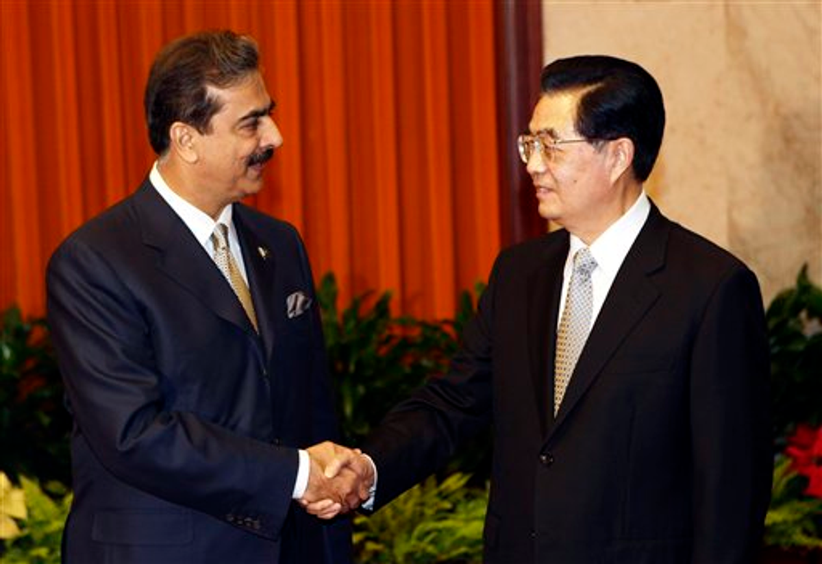Pakistani Prime Minister Yousuf Raza Gilani, left, is welcomed by Chinese President Hu Jintao for a meeting at the Great Hall of the People in Beijing Friday, May 20, 2011. 