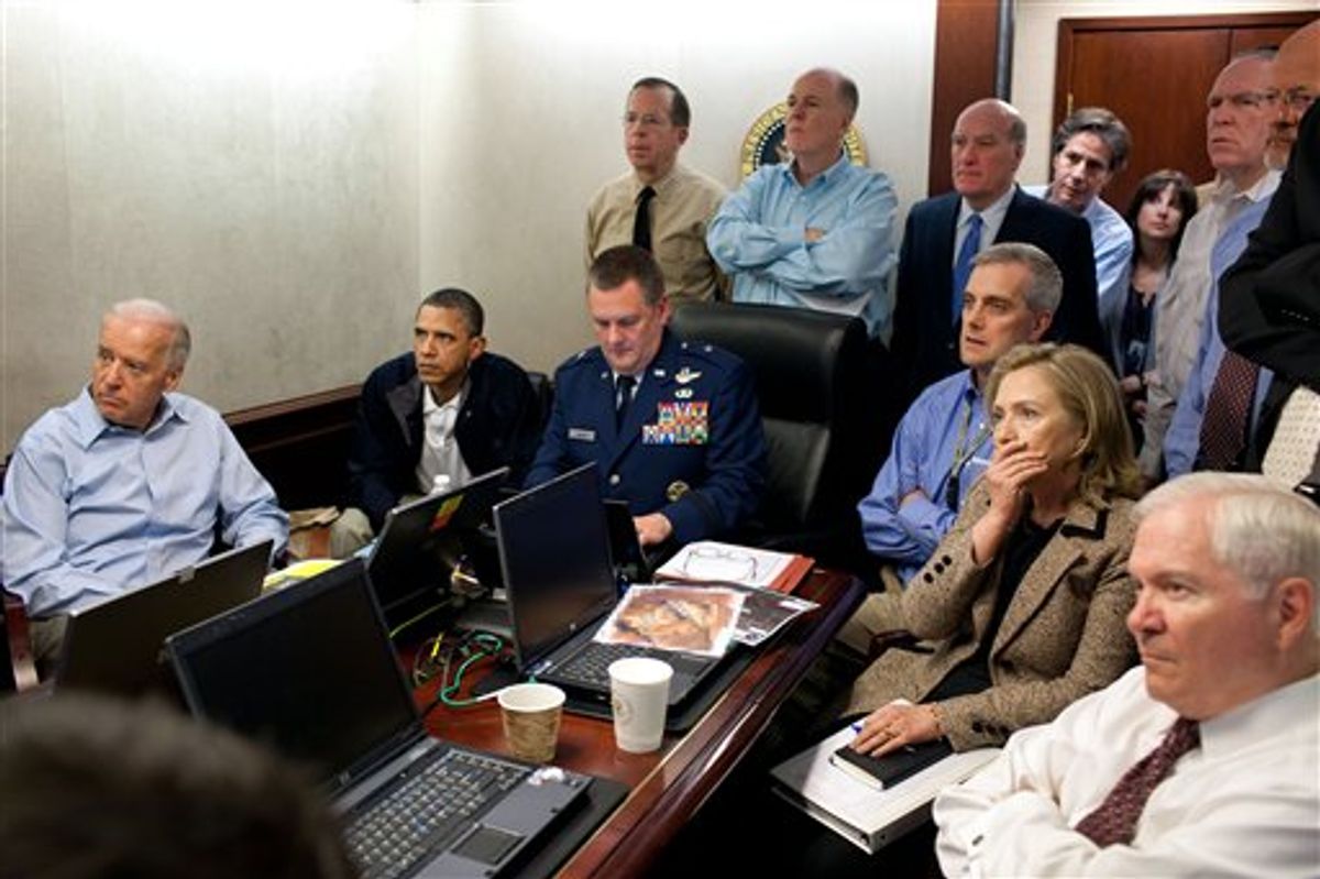 In this image released by the White House and digitally altered by the source to diffuse the paper in front of Secretary of State Hillary Rodham Clinton, President Barack Obama and Vice President Joe Biden, along with with members of the national security team, receive an update on the mission against Osama bin Laden in the Situation Room of the White House, Sunday, May 1, 2011, in Washington. (AP Photo/The White House, Pete Souza) (AP)