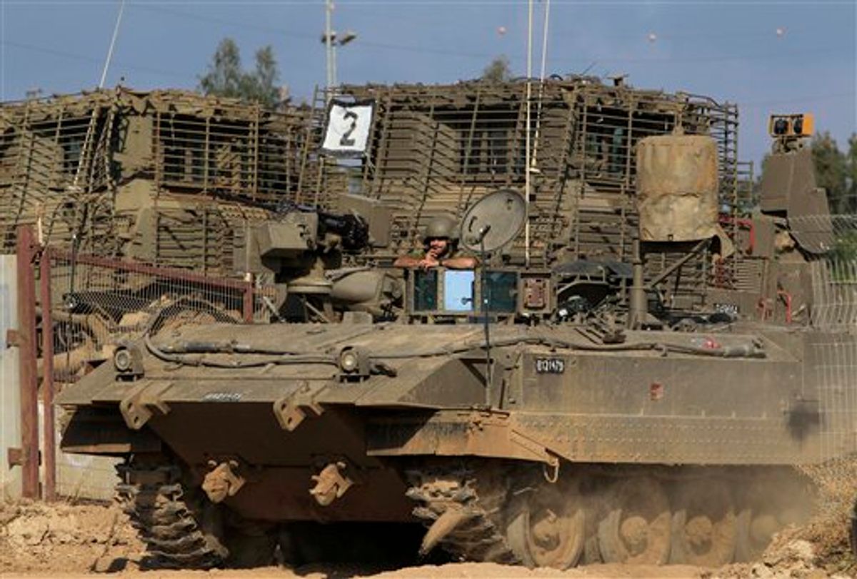 An Israeli tank advances near an army base on the Israel Gaza border in southern Israel, Sunday, May 8, 2011. Israel will mark its annual remembrance day for soldiers and civilians killed over the years in the region's wars and conflicts. (AP Photo/Tsafrir Abayov) (AP)