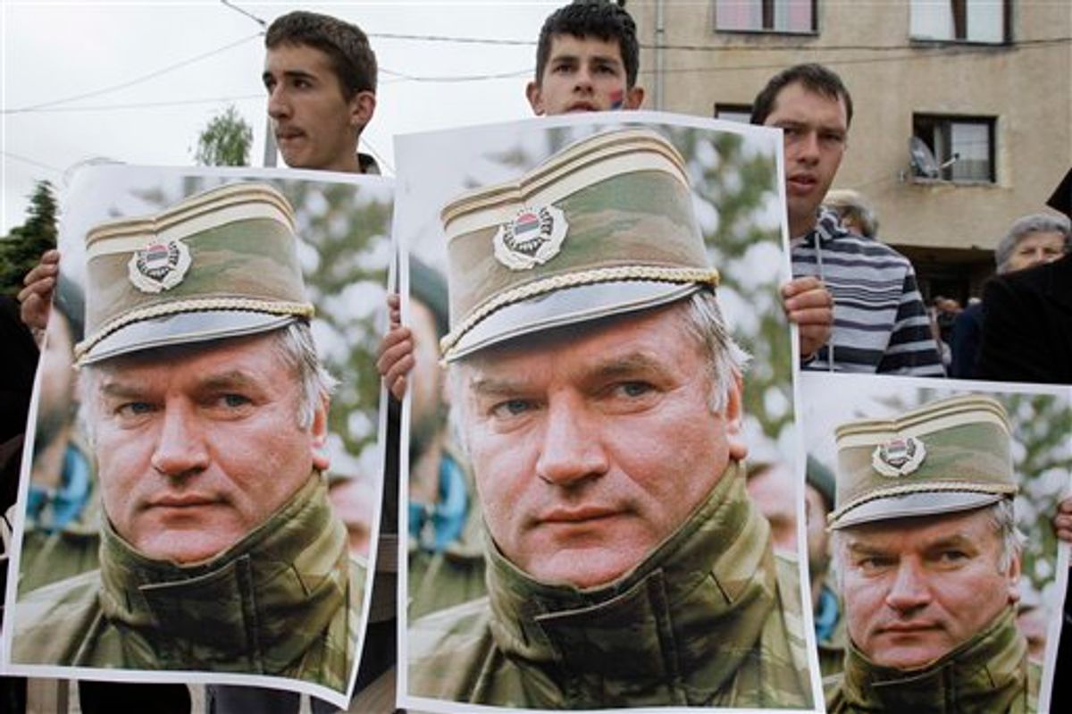 Bosnian Serb people holding photos of former Gen. Ratko Mladic during a protest in Kalinovik, Bosnia, hometown of the Bosnian Serb wartime military leader, 70 kms southeast of Sarajevo, Sunday, May 29, 2011. Approximately 3,000 Bosnian Serbs, gathered to show support and anger after the arrest of Mladic. Protestors carried banners and flags and sang songs in his support, he was arrested after 16 years in hiding from the International War Crimes Tribunal in the Hague. Mladic is to face trial on 15 accounts of war crimes including genocide in Srebrenica in 1995. (AP Photo/Amel Emric) (AP)