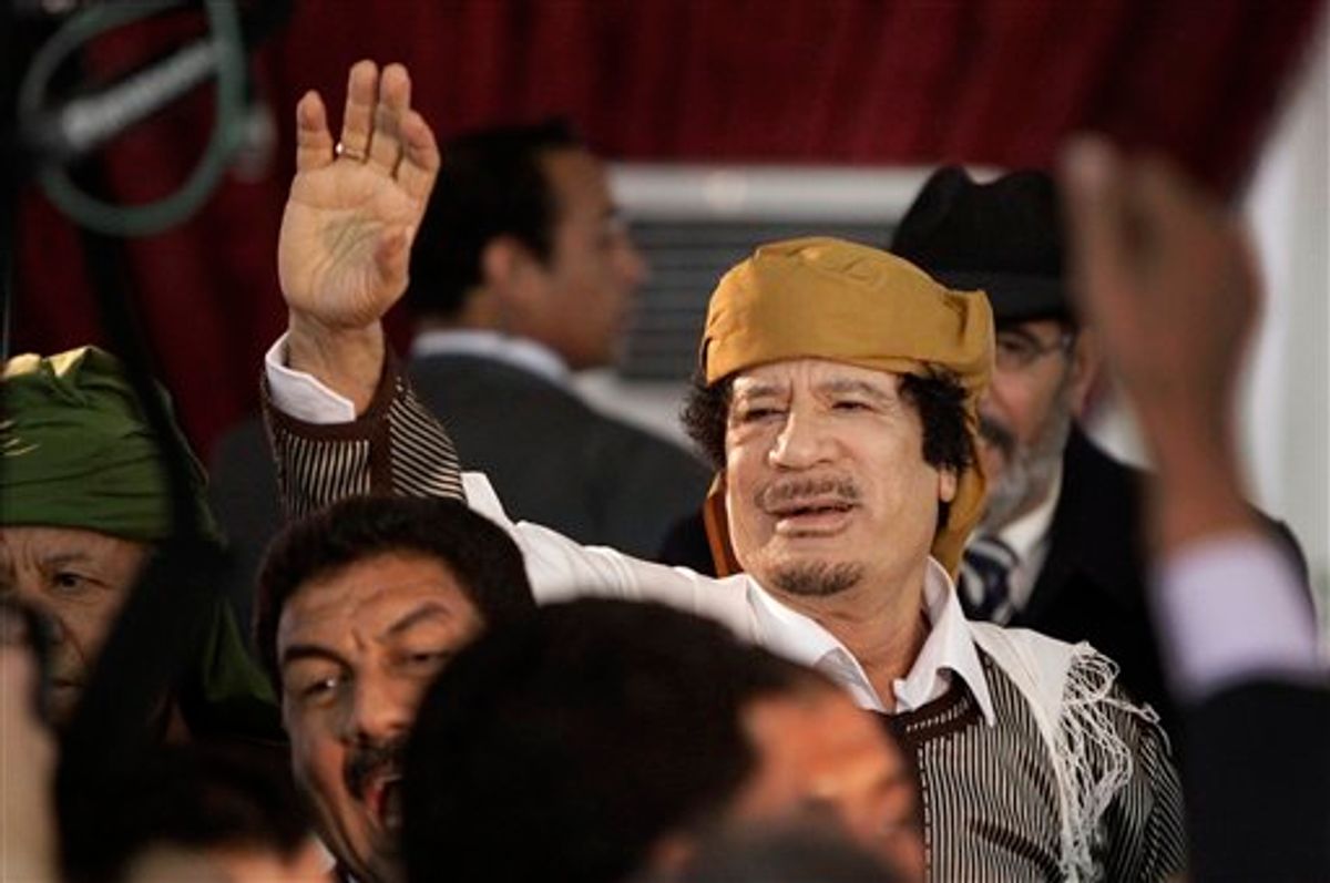 FILE - In this March 2, 2011 file photo, Libyan Leader Moammar Gadhafi waves to supporters as he arrives to speak in Tripoli, Libya. Moammar Gadhafi says he's alive after NATO attacks and has support of millions of Libyans. (AP Photo/Ben Curtis, File) (Associated Press)