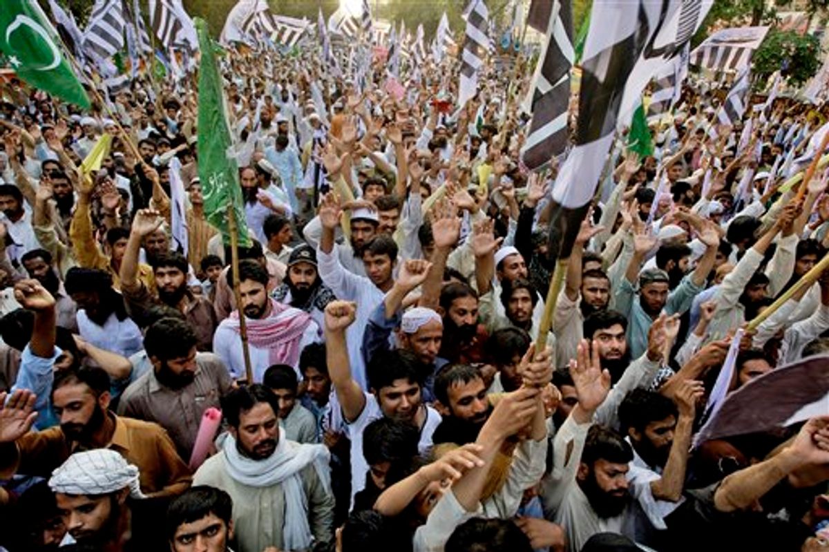 Supporters of Pakistani religious group Jamaat-ud-Dawa, rally to condemn the United States for the killing of al-Qaida leader Osama bin Laden, Sunday, May 15, 2011 in Lahore, Pakistan. Party's chief Hafiz Saeed called bin Laden a martyr and demanded the Pakistani government break ties with the United States. (AP Photo/K.M.Chaudary) (AP)