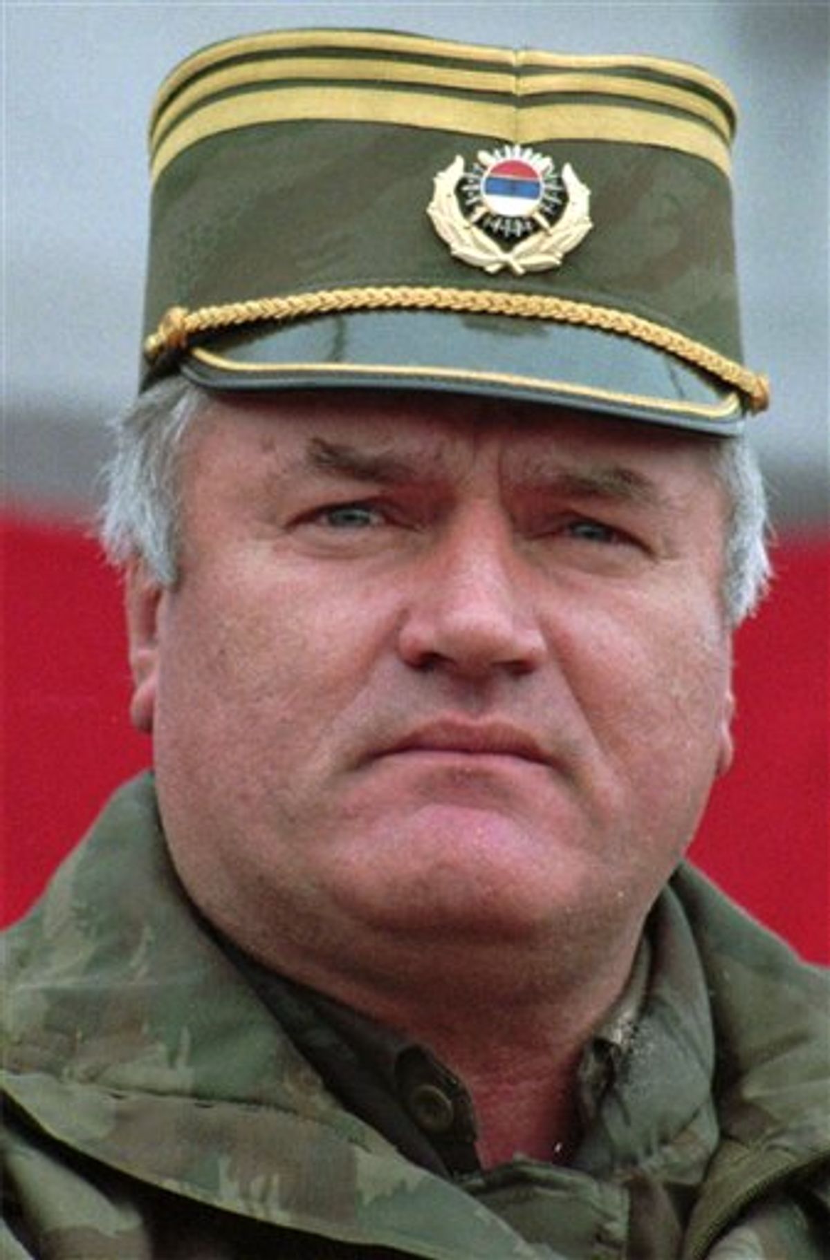 FILE - Bosnian-Serb General Ratko Mladic is seen in this 1995 file photo during a visit to troops in the east Bosnian town of Vlasenica.  Belgrade's B-92 radio reports Thursday May 26, 2011 that a man suspected to be Europe's most wanted war crimes fugitive Ratko Mladic has been arrested in Serbia. Serbia's war crimes prosecutors refused to confirm or deny the report.   (AP Photo/Oleg Stjepanovic) (AP)