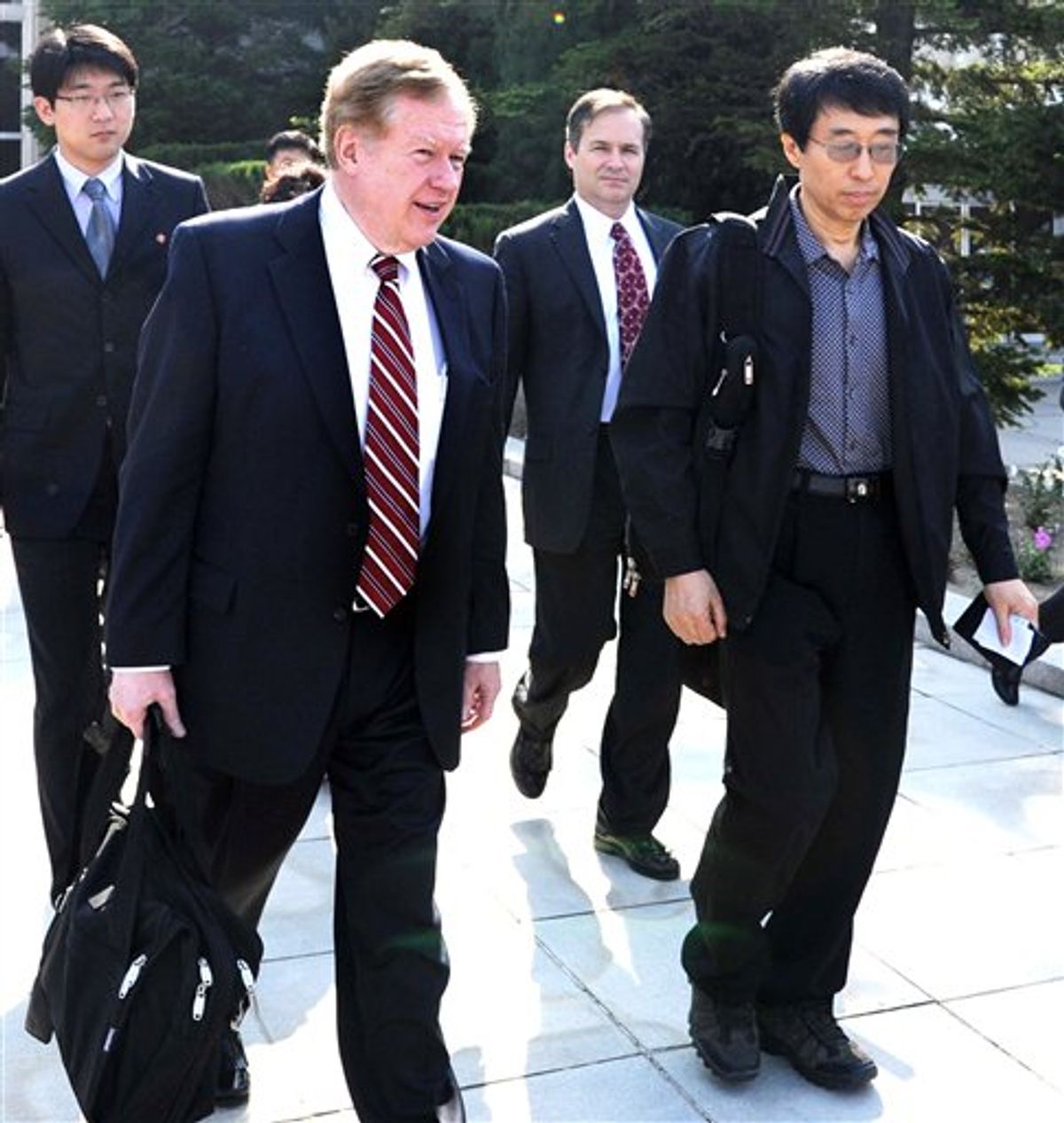 Robert King, left, U.S. special envoy for North Korean human rights issues, and U.S. citizen Eddie Jun, right, prepare to leave Pyongyang, North Korea, on Saturday May 28, 2011. The American held by North Korea for a half year reportedly for proselytizing is returning to the United States, brought out by the U.S. envoy who negotiated his release. (AP Photo/Kyodo News) JAPAN OUT, MANDATORY CREDIT, NO LICENSING IN CHINA, HONG KONG, JAPAN, SOUTH KOREA AND FRANCE (AP)