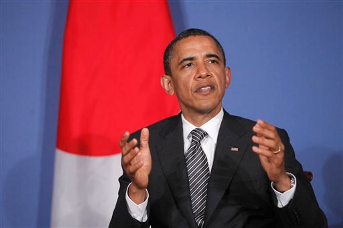 President Barack Obama speaks to reporters as he meets with Japan's Prime Minister Naoto Kan at the G8 summit in Deauville, France, Thursday, May 26, 2011. (AP Photo/Charles Dharapak) (AP)