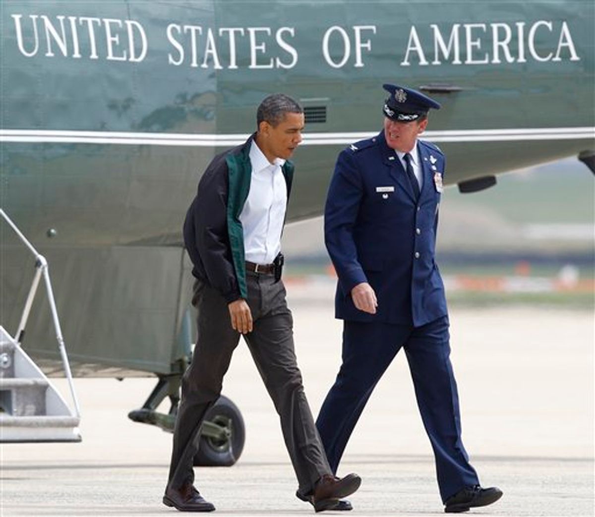 President Barack Obama walks with Col. Lee dePalo, Vice Commander of the 11th Wing, towards Air Force One at Andrews Air Force Base, Md., Sunday, May 29, 2011, on his way to visit tornado victims in Joplin, Mo. (AP Photo/Luis M. Alvarez) (AP)
