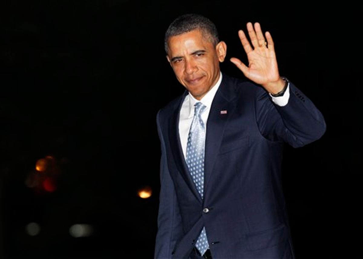 President Barack Obama waves to media as he walks from Marine One to the White House, Wednesday, May 11, 2011, in Washington, as he travels from Texas. (AP Photo/Carolyn Kaster) (AP)