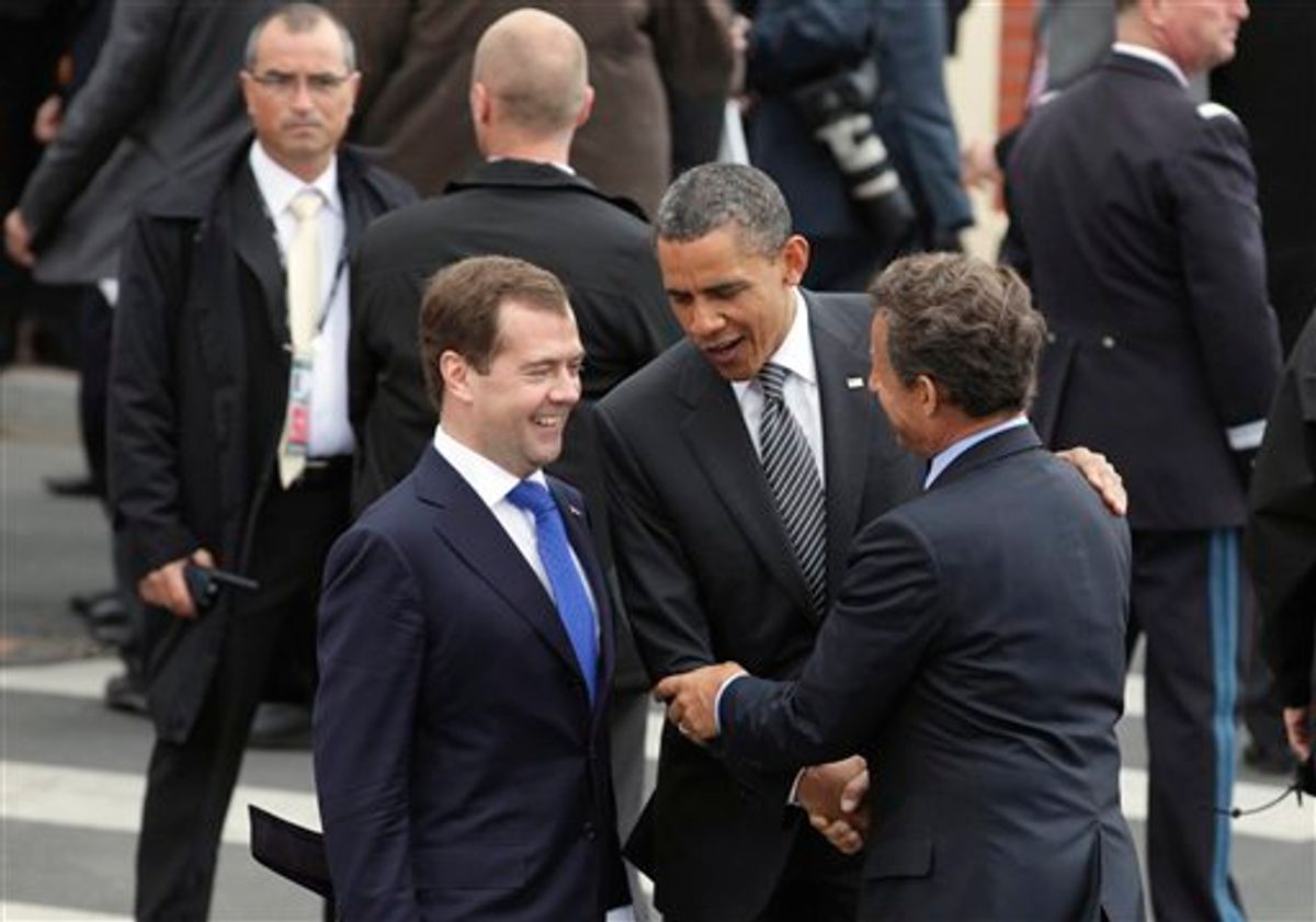 Russian President Federation Dmitry Medvedev, left, and President Barack Obama are greeted by French President Nicolas Sarkozy as they arrive at the G8 Summit, in Deauville, France, Thursday, May 26, 2011. (AP Photo/Carolyn Kaster)  (AP)