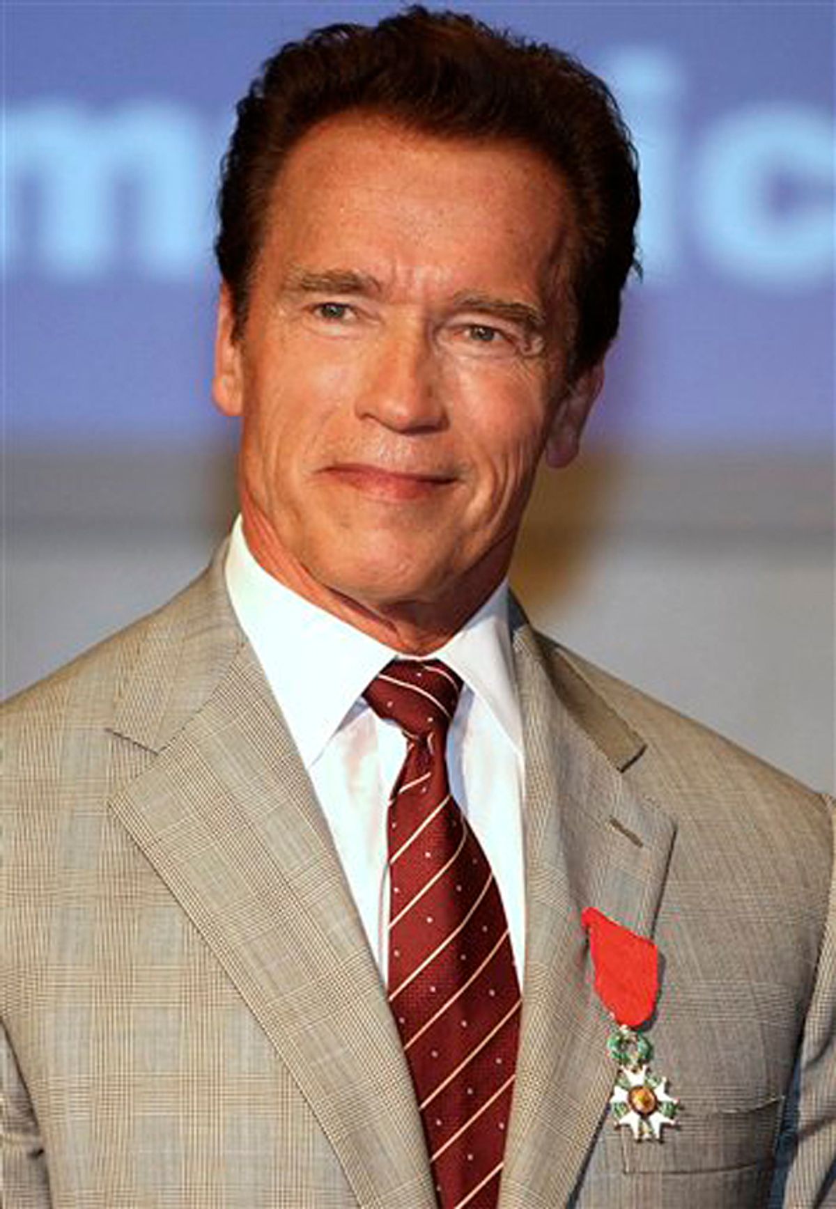 Austrian-American, actor and former California Governor Arnold Schwarzenegger, poses after receiving the insignia of Chevalier in the Order of the Legion of Honor  during the MIPTV (International Television Programme Market), Monday, April 4, 2011, in Cannes, southern France. Arnold Schwarzenegger is back in Cannes for the first time in eight years to unveil a new international television series "The Governator". (AP Photo/Lionel Cironneau) (Lionel Cironneau)