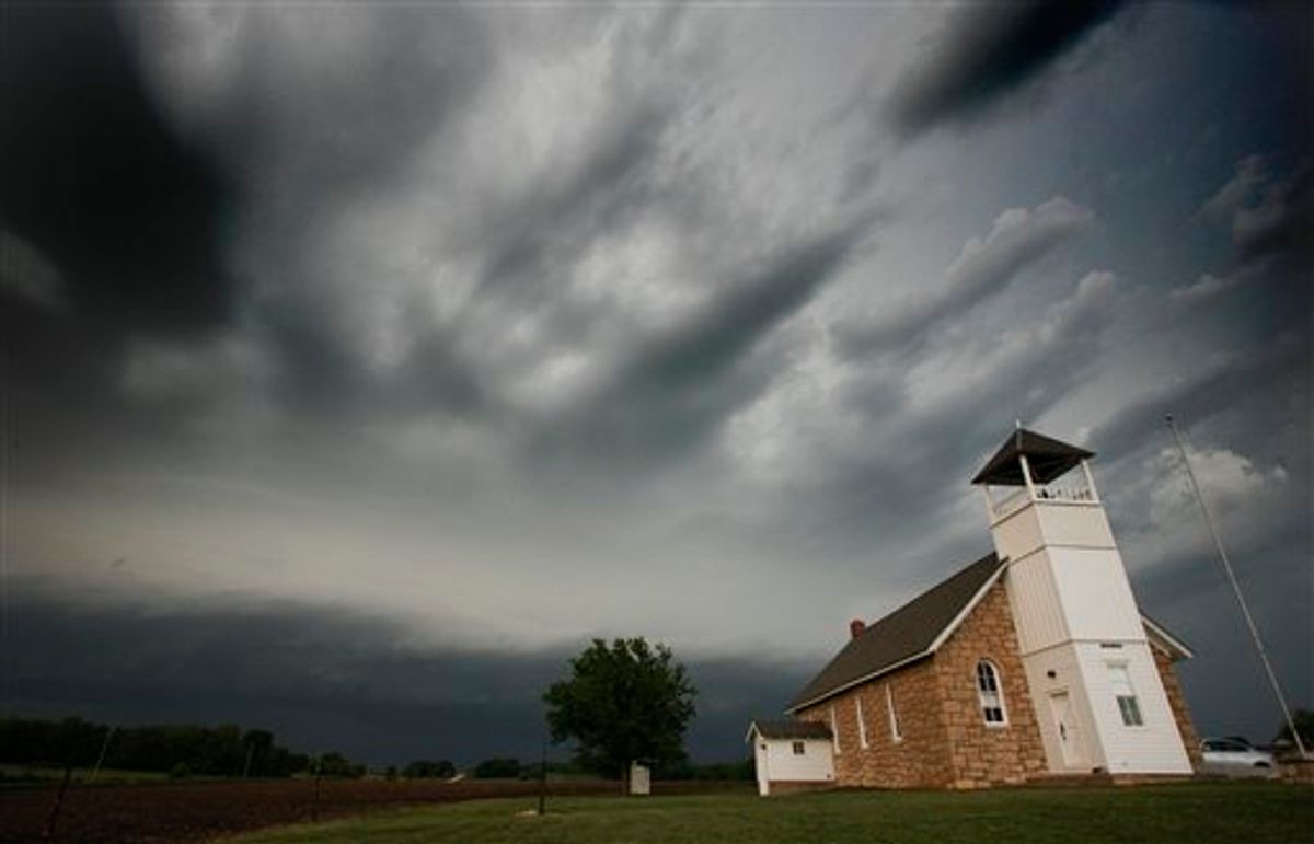 Storms clouds pass behind Buck Creek School near Lawrence, Kan., Saturday, May 21, 2011. (AP Photo/Orlin Wagner)  (AP)