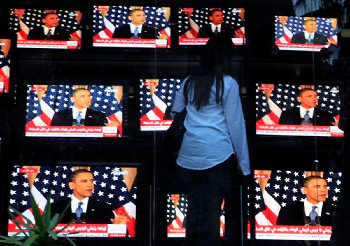 An Egyptian woman watches U.S. President Barack Obama's policy address, outside a shop selling televisions in Cairo, Egypt Thursday, May 19, 2011. President Barack Obama on Thursday endorsed a key Palestinian demand for the borders of its future state and prodded Israel to accept that it can never have a truly peaceful nation based on "permanent occupation." (AP Photo/Amr Nabil) (AP)