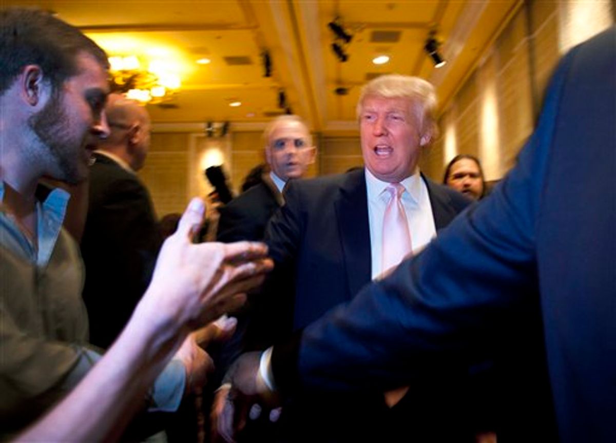 Donald Trump greets supporters before speaking to a crowd of 600 people during a gathering of Republican women's groups, Thursday, April 28, 2011, in Las Vegas. Trump's flirtation with a White House bid continued Thursday night with a lavish reception at the Treasure Island casino in Las Vegas.(AP Photo/Julie Jacobson) (AP)