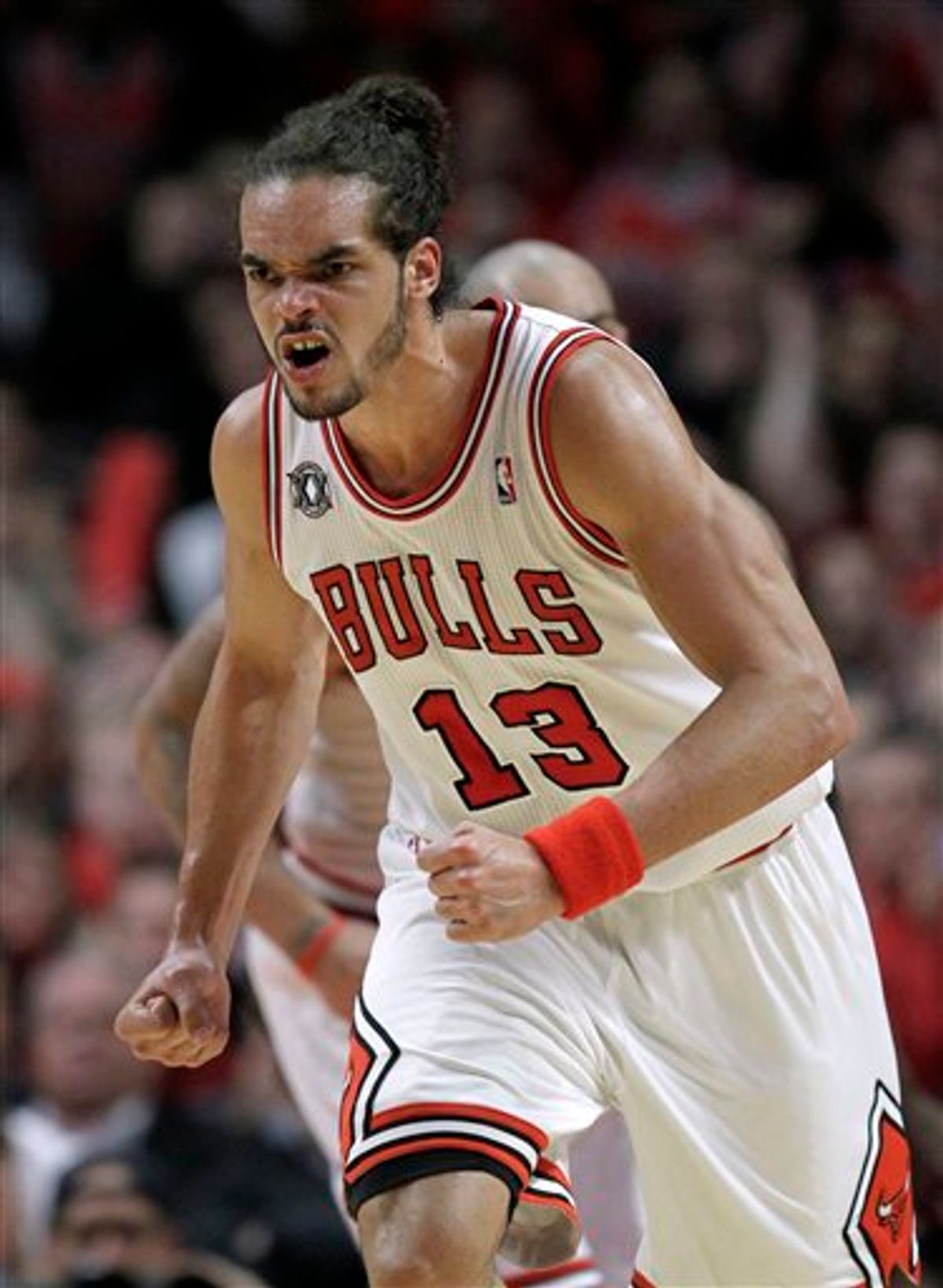 Chicago Bulls' Joakim Noah reacts after scoring a basket during the second quarter in Game 2 of a first-round NBA playoff basketball series against the Indiana Pacers, in Chicago on Monday, April 18, 2011. (AP Photo/Nam Y. Huh) (AP)