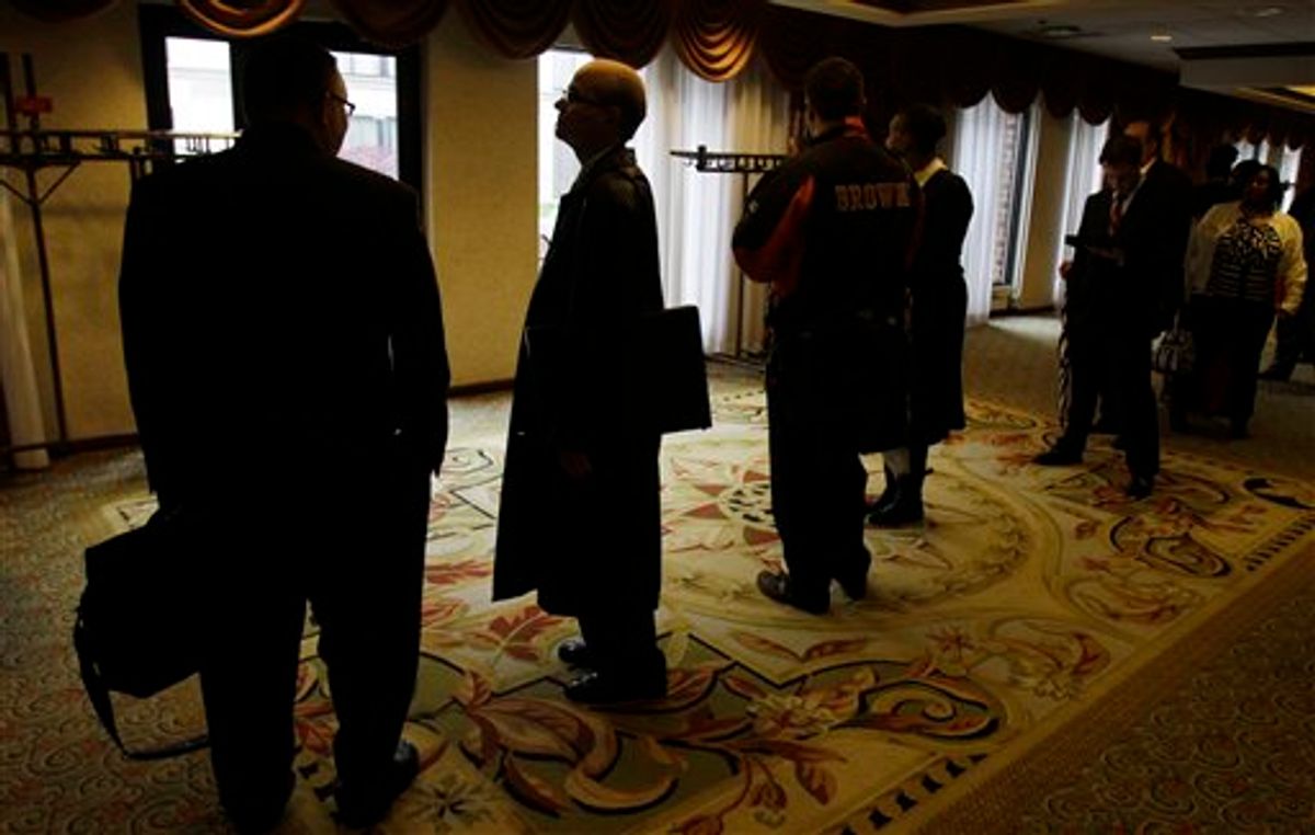 In this May 3, 2011 photo, job seekers wait in line for a job fair to open, in Independence, Ohio. The number of Americans applying for unemployment benefits surged last week to the highest level in eight months, a sign the job market may be weakening.(AP Photo/Tony Dejak) (AP)