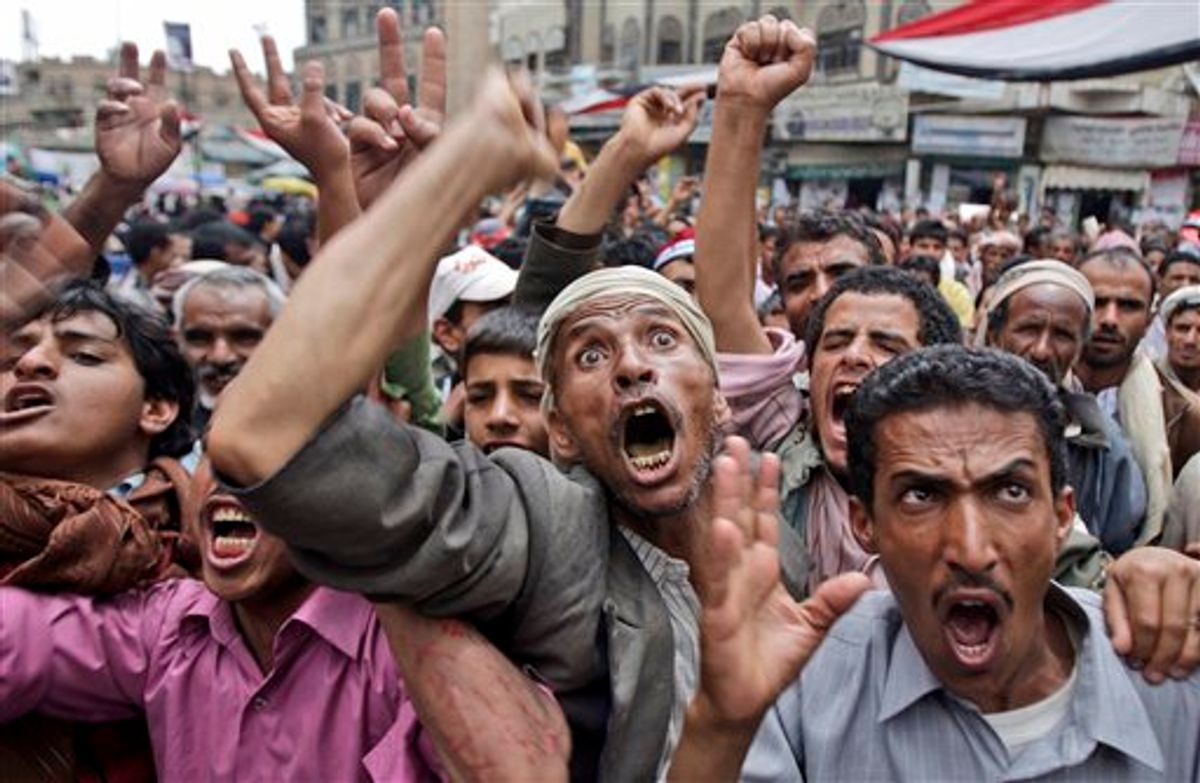 Anti-government protestors react during a demonstration demanding the resignation of Yemeni President Ali Abdullah Saleh, in Sanaa,Yemen, Thursday, May 5, 2011. Yemen, which is currently wracked by the popular protests against the country's deeply unpopular president, is also home to one of the most active branches of al-Qaida, which has planned several attacks against the U.S. (AP Photo/Hani Mohammed) (AP)