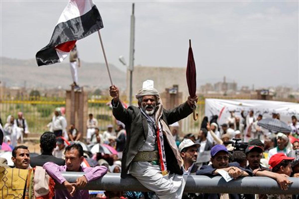 An anti-government protestor, reacts during a demonstration demanding the resignation of Yemeni President Ali Abdullah Saleh, in Sanaa, Yemen, Friday, June 3, 2011. A government official says Yemen's president was lightly injured and four top officials wounded when opposition tribesmen struck his palace with rockets Friday. (AP Photo/Hani Mohammed) (AP)